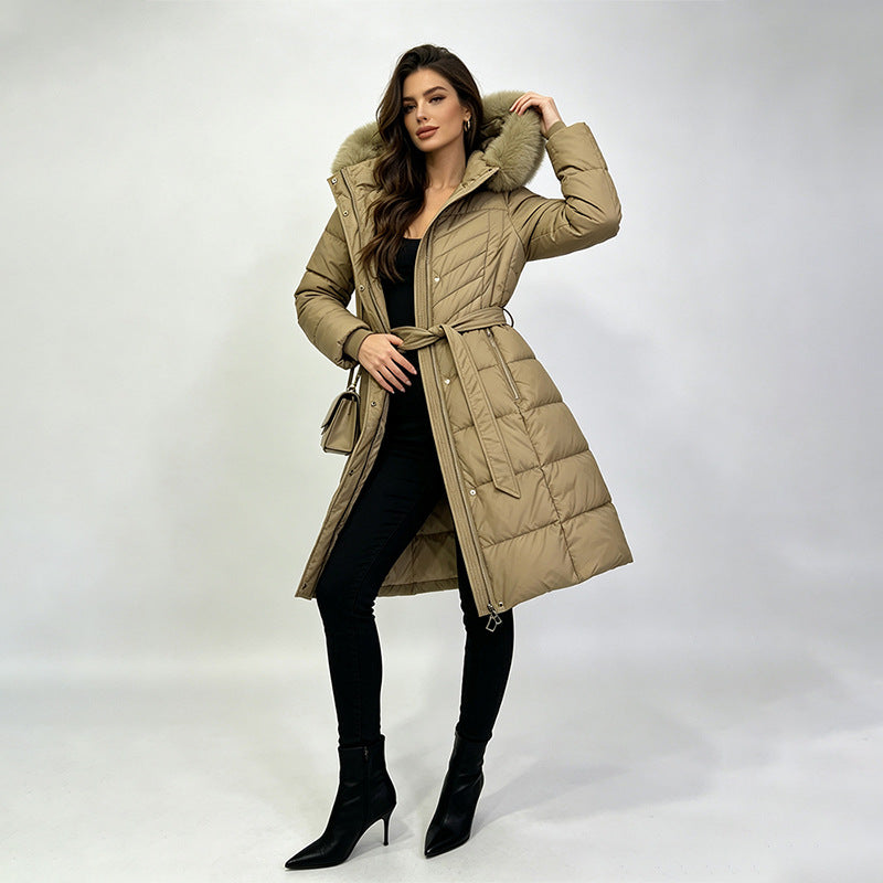 Women's long belted puffer coat with fur-trimmed hood, light khaki
