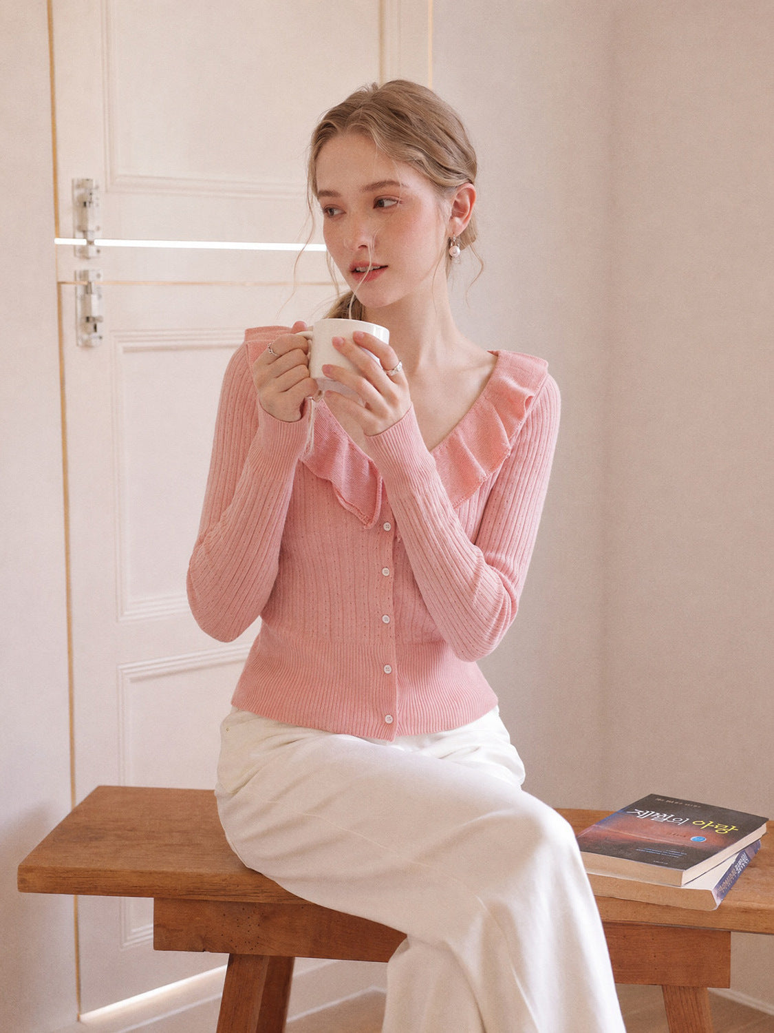 Pink long-sleeve knit V-neck button top with ruffled collar, slim fit