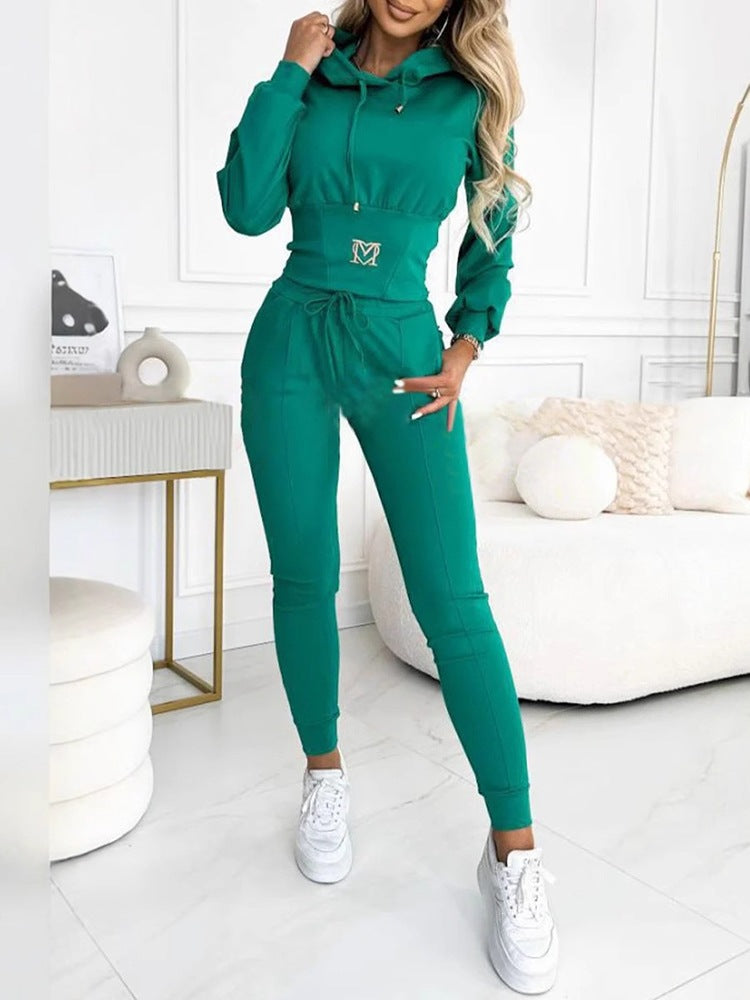 Green hooded top and long jogger pants set, drawstring waist and front logo.