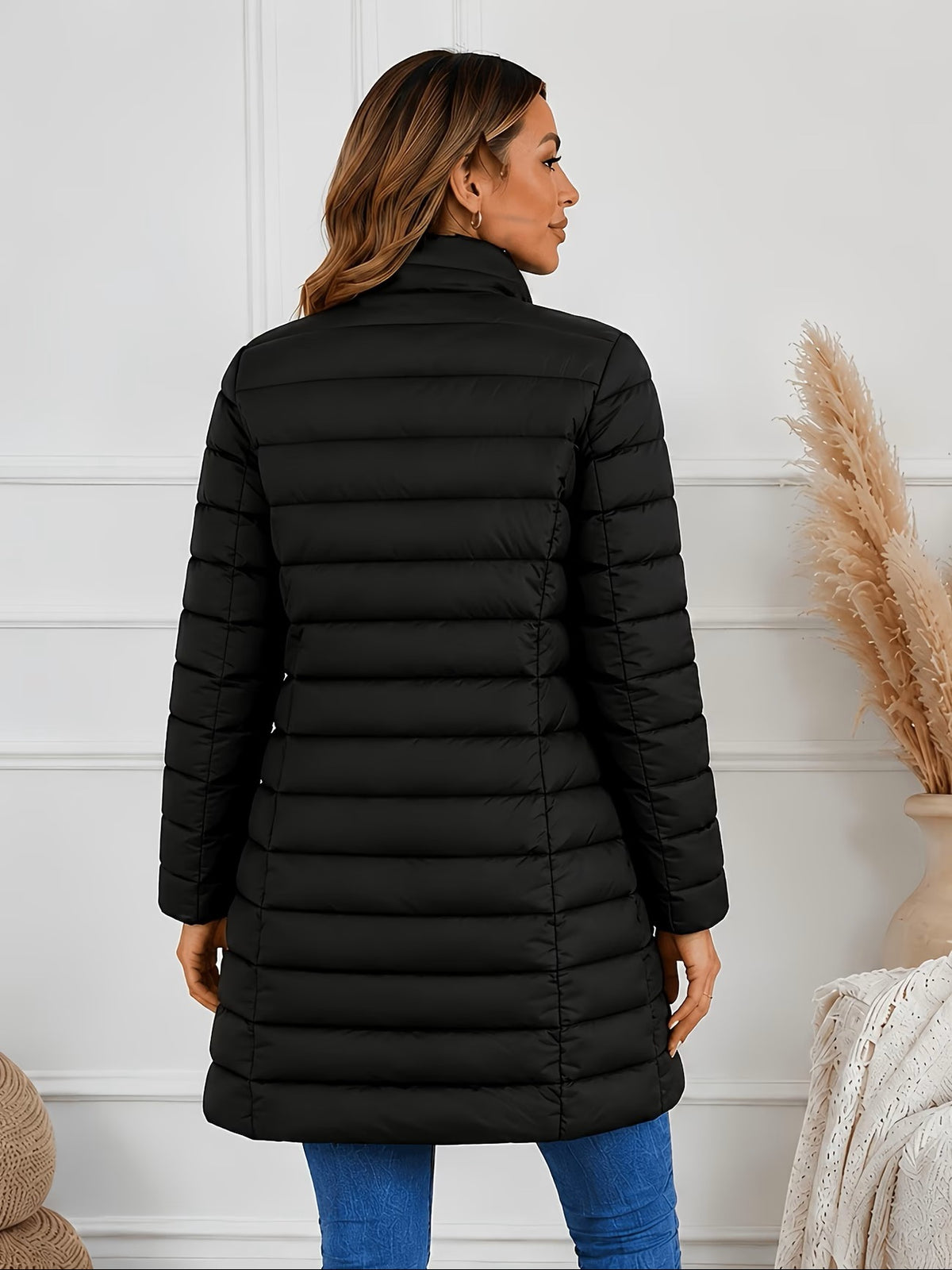 Women\u2019s black quilted puffer jacket, stand collar, mid-length back view