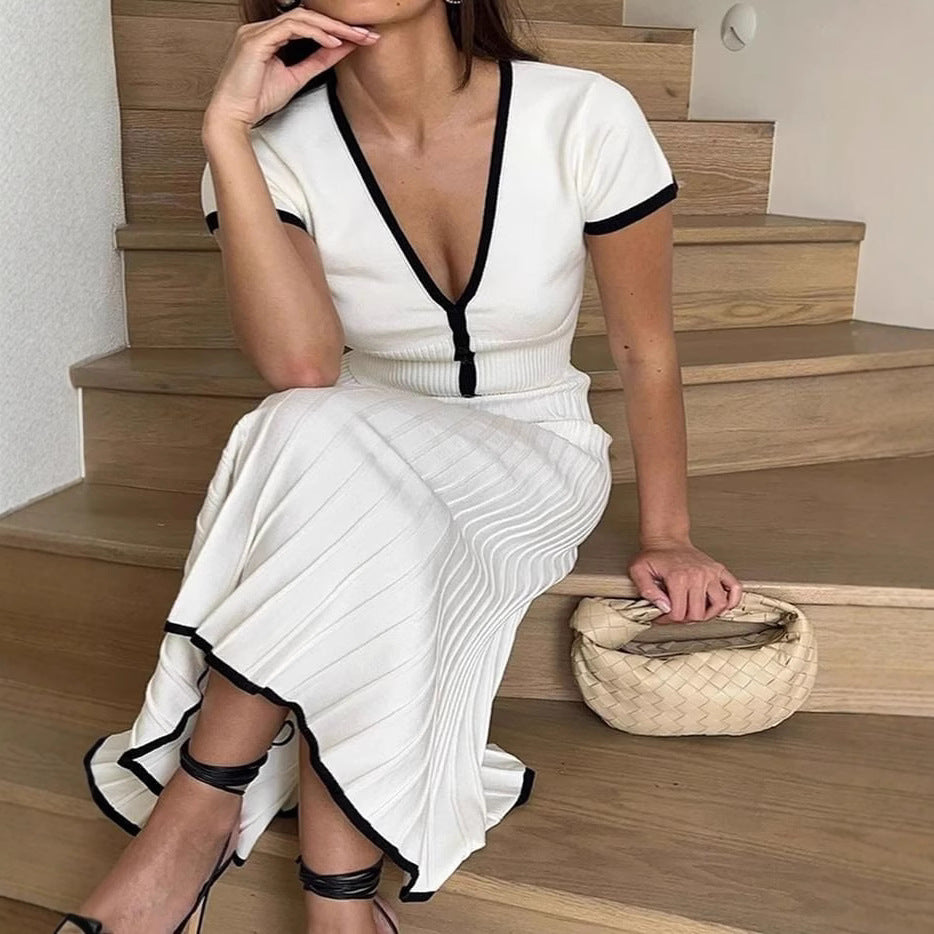 White knit two-piece set with cropped top detail buttons and pleated midi skirt