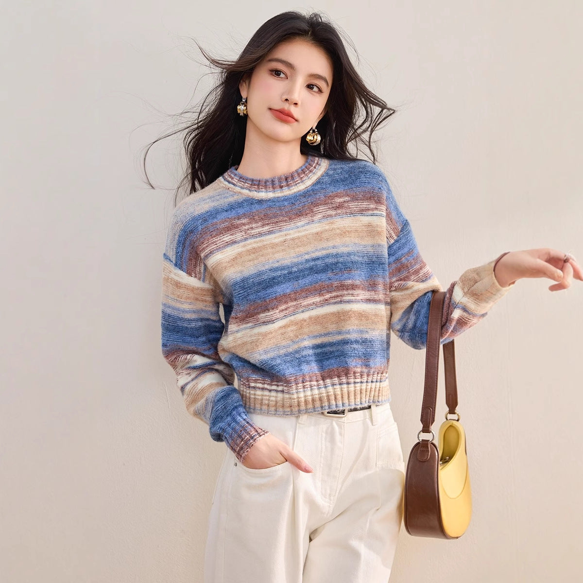 Women’s blue striped gradient knit sweater with ribbed round neck and long sleeves