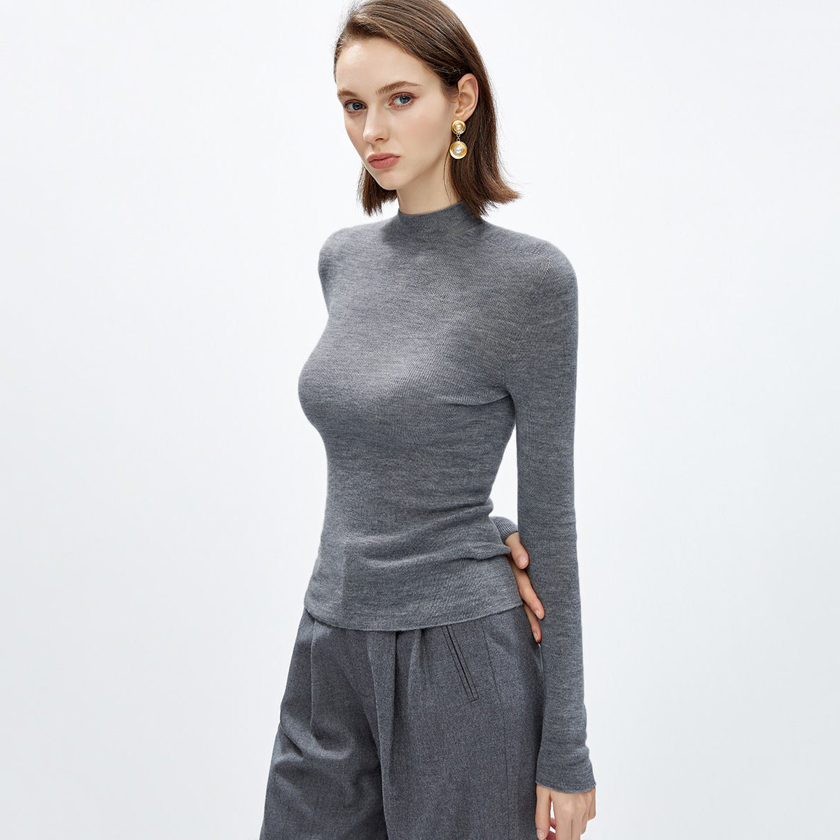 Merino wool turtleneck knit sweater, light gray, fitted long sleeves, semi-high collar