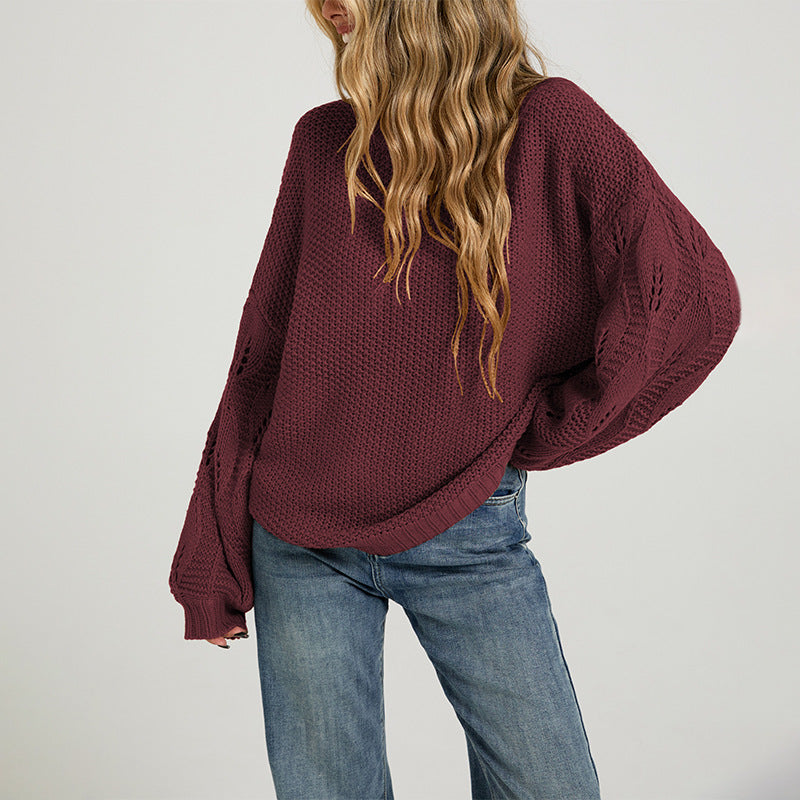 Burgundy open-stitch sweater with dropped shoulder and ribbed cuffs, side view