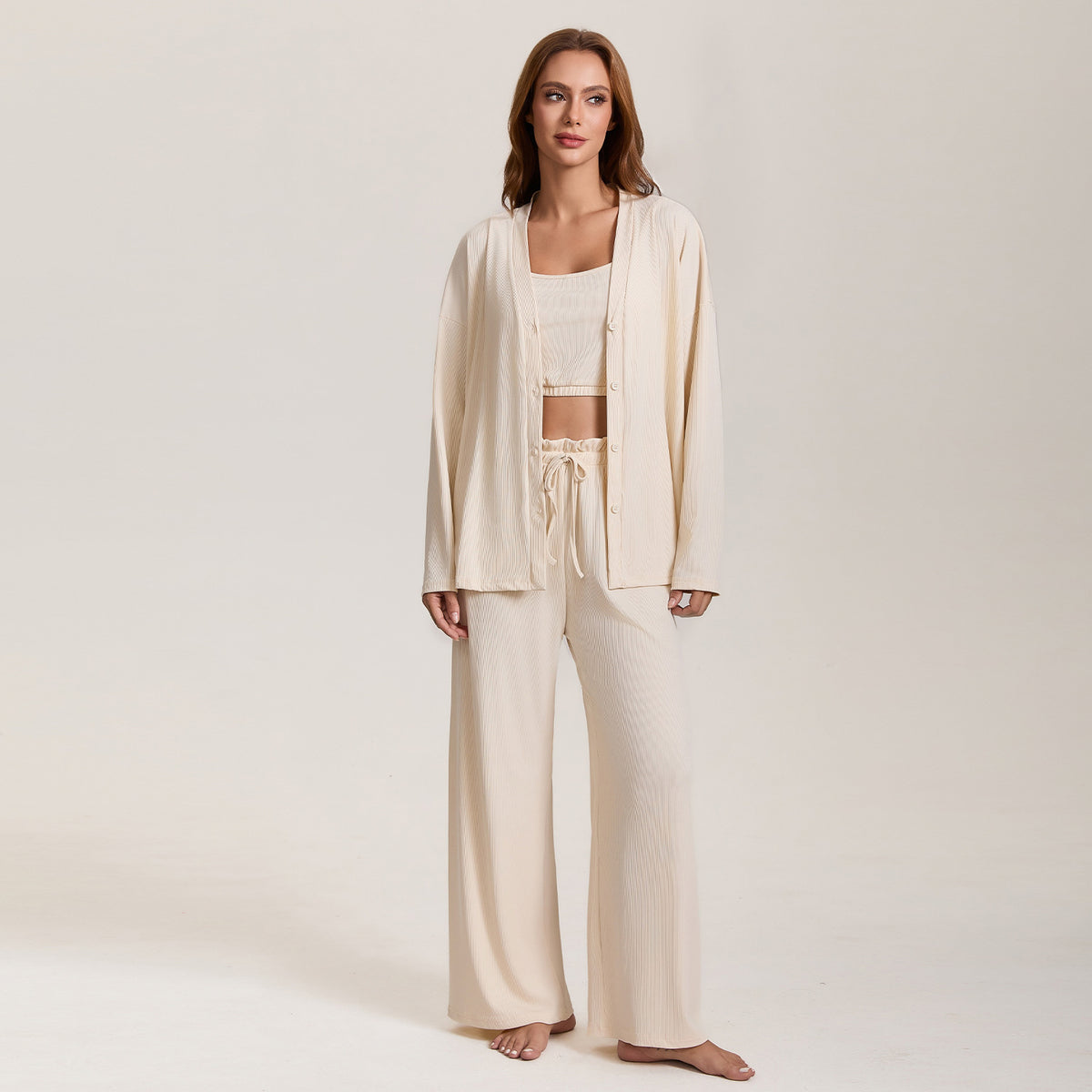 Women’s cream pajama three-piece set with long-sleeve lounge jacket and flowy wide-leg pants