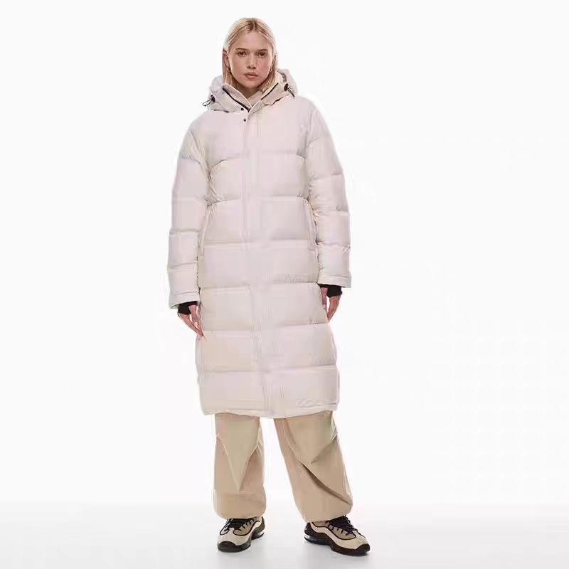 Light pink long hooded puffer coat with zip front and quilted baffles