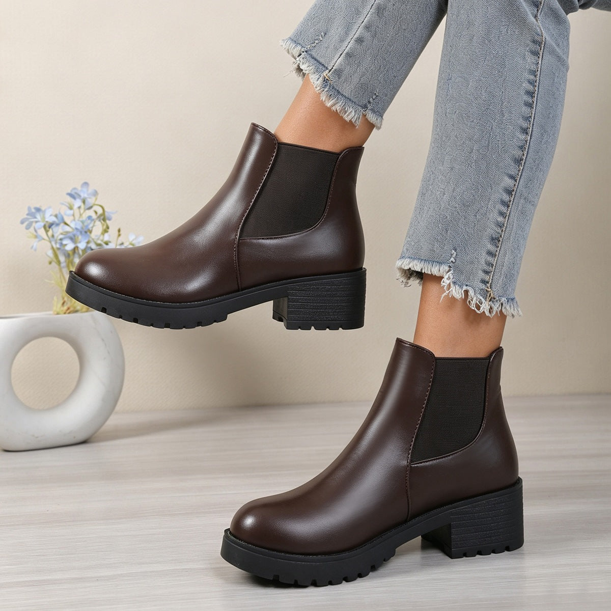 Dark brown Chelsea ankle boots with rounded toe, elastic side panels, and chunky block heel