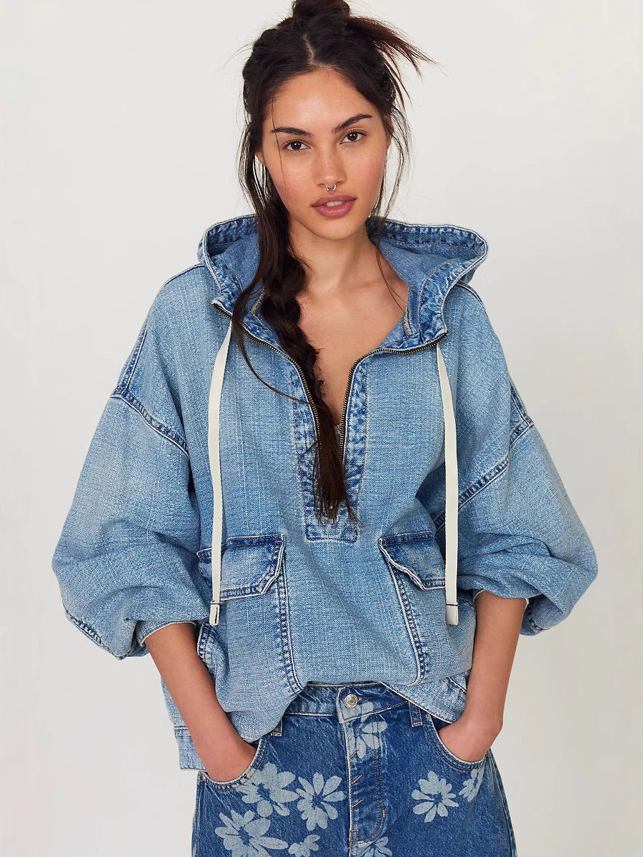 Light blue hooded denim jacket with half-zip and drawstring cuffs