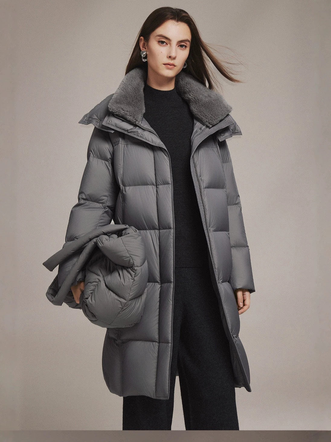 Women's gray long down jacket with fur-trimmed oversized collar and quilted padding