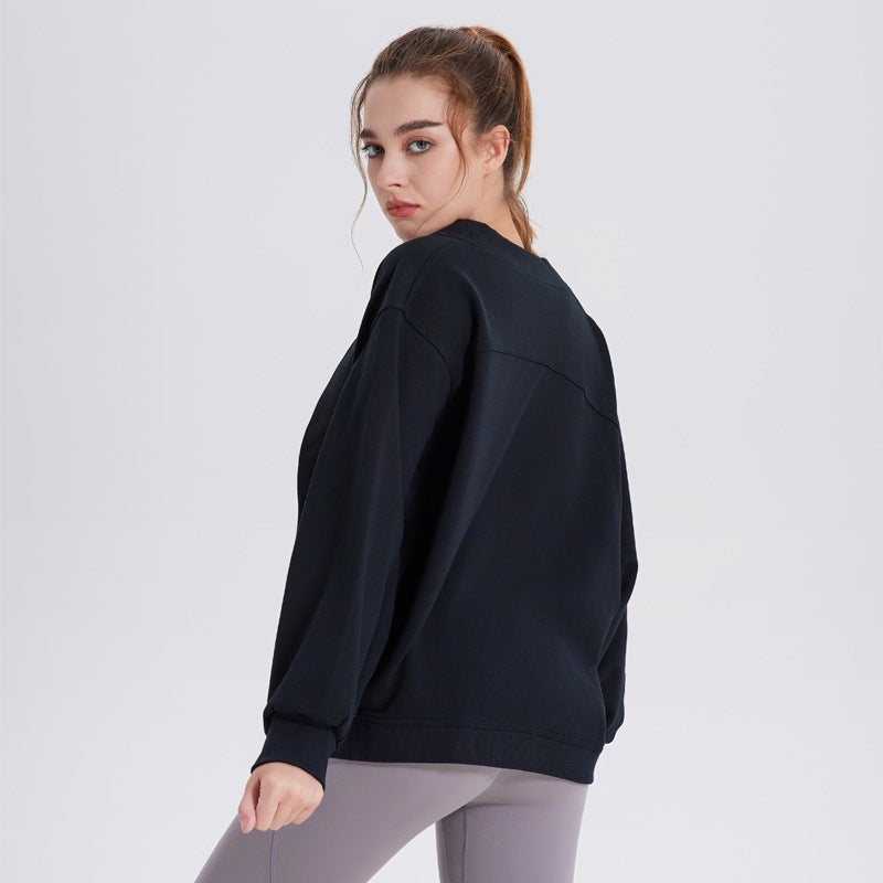Women’s dark navy athletic cardigan top, long sleeves, back view