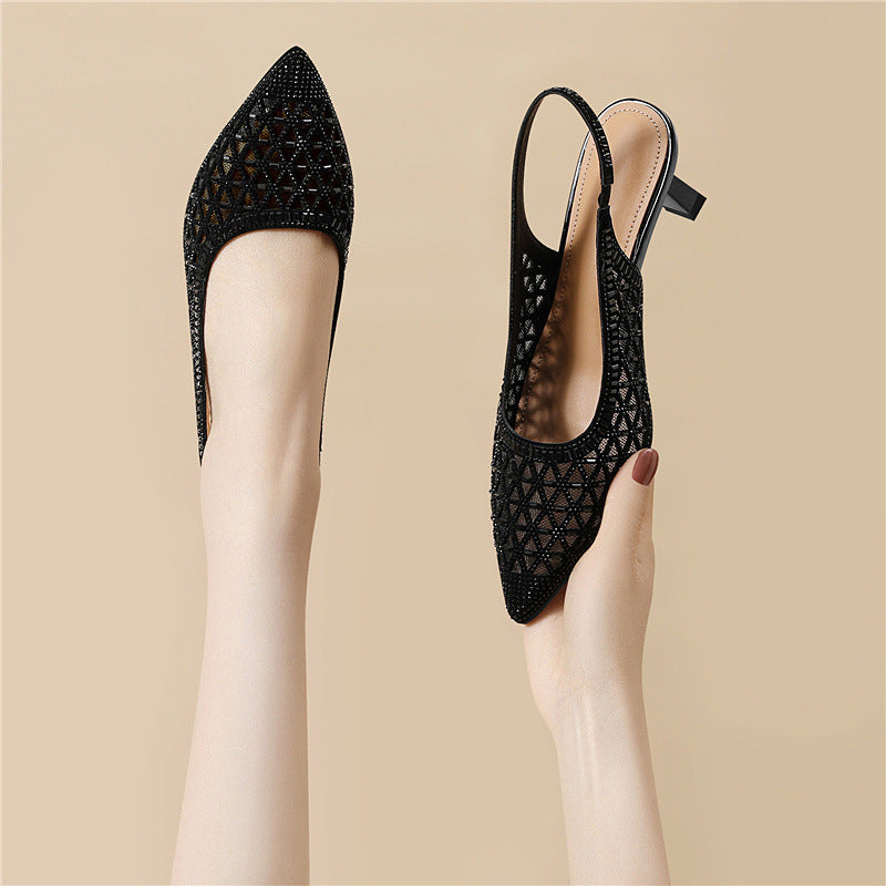 Black pointed-toe slingback heels with geometric cutout pattern and thin heel.