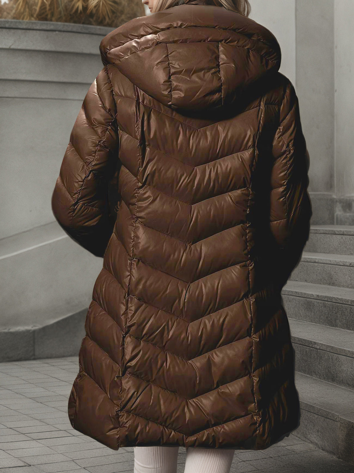 Women's long brown quilted puffer coat with hood, full back view
