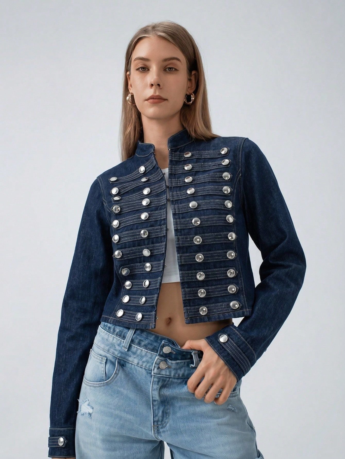 Women’s short blue denim jacket with stand collar and double-breasted silver snap studs