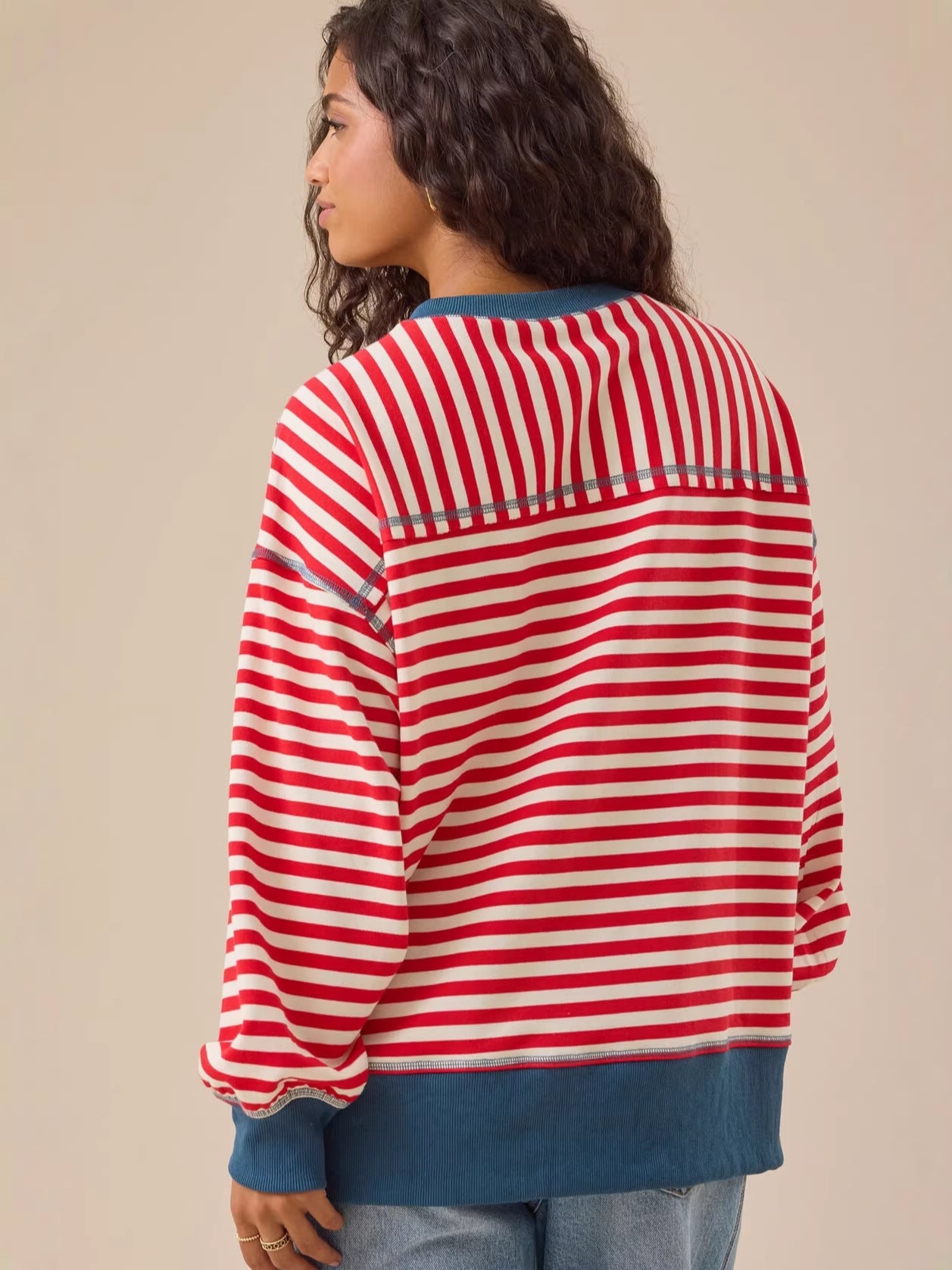 Red and white striped sweatshirt back view, round neck, blue hem and sleeve cuff bands