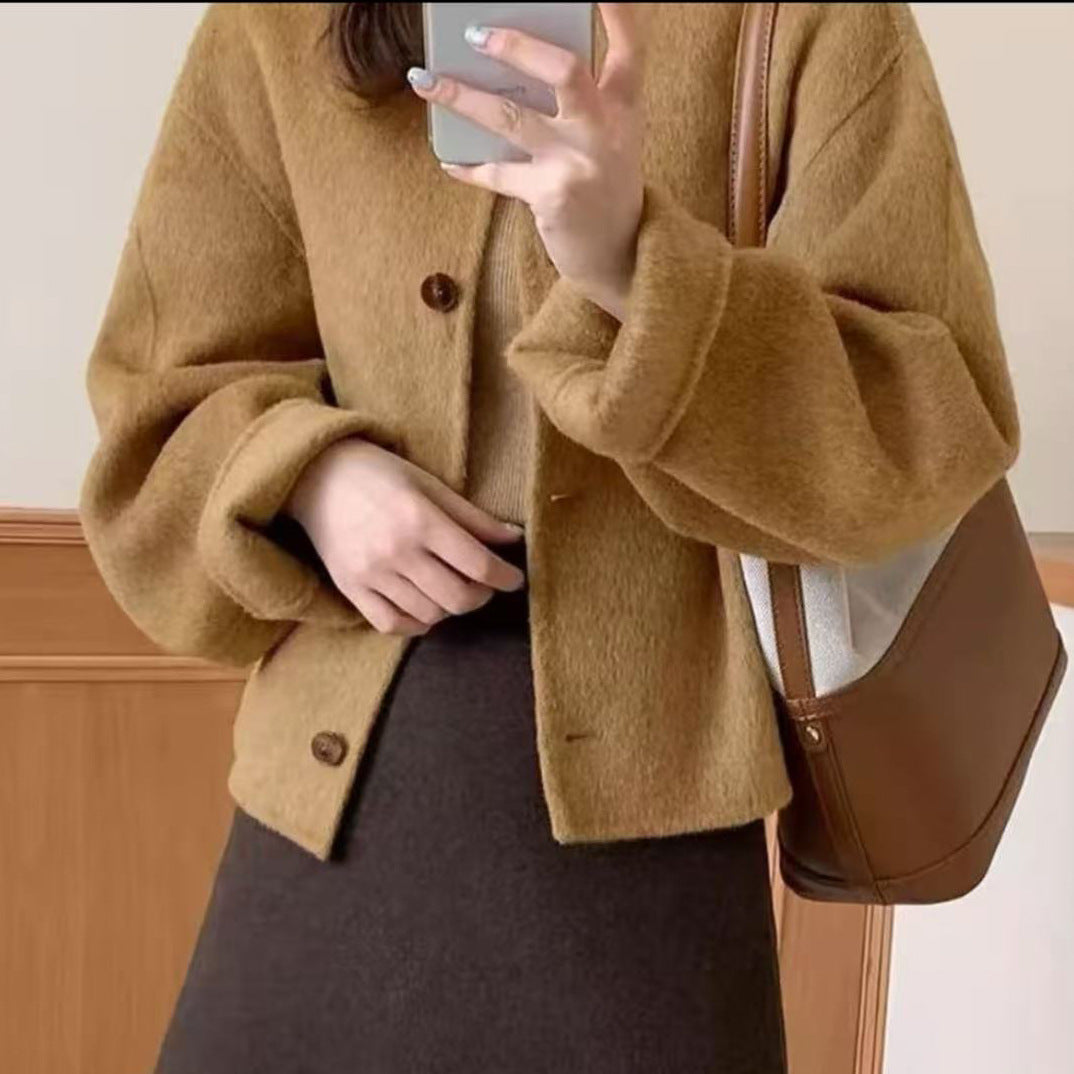 Women’s tan boiled wool jacket with button front and stand collarless neckline