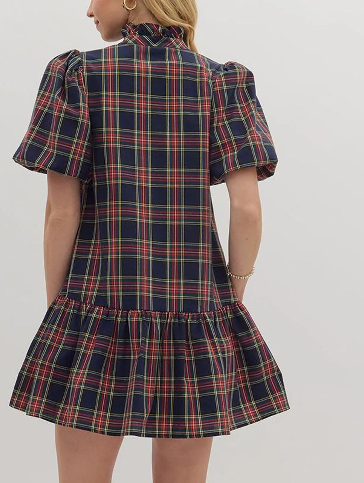 Navy plaid A-line dress back view with short puff sleeves and tiered hem
