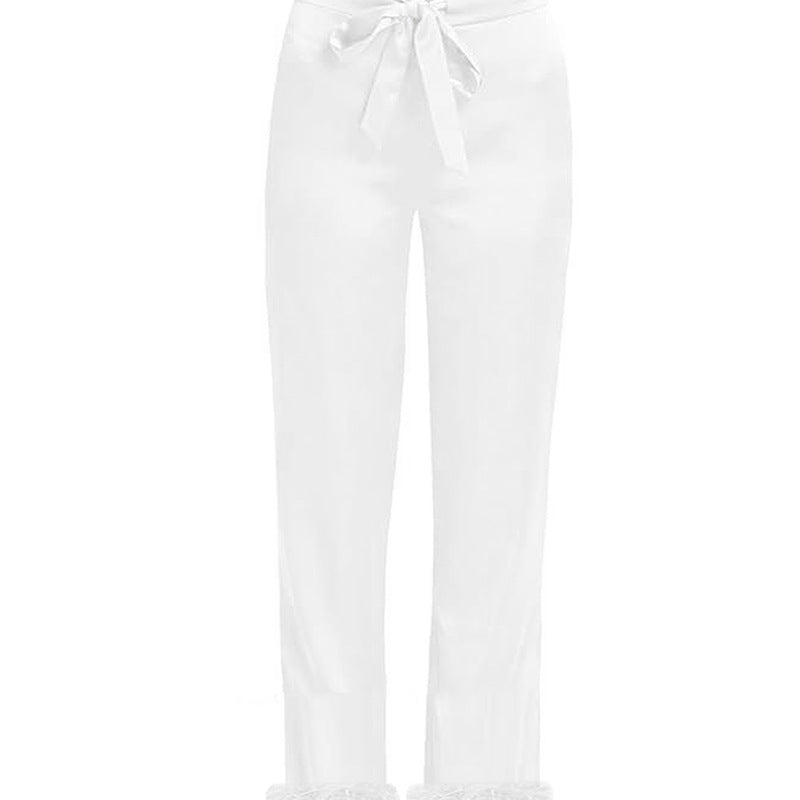 White pajama pants with tied drawstring waist and straight relaxed legs