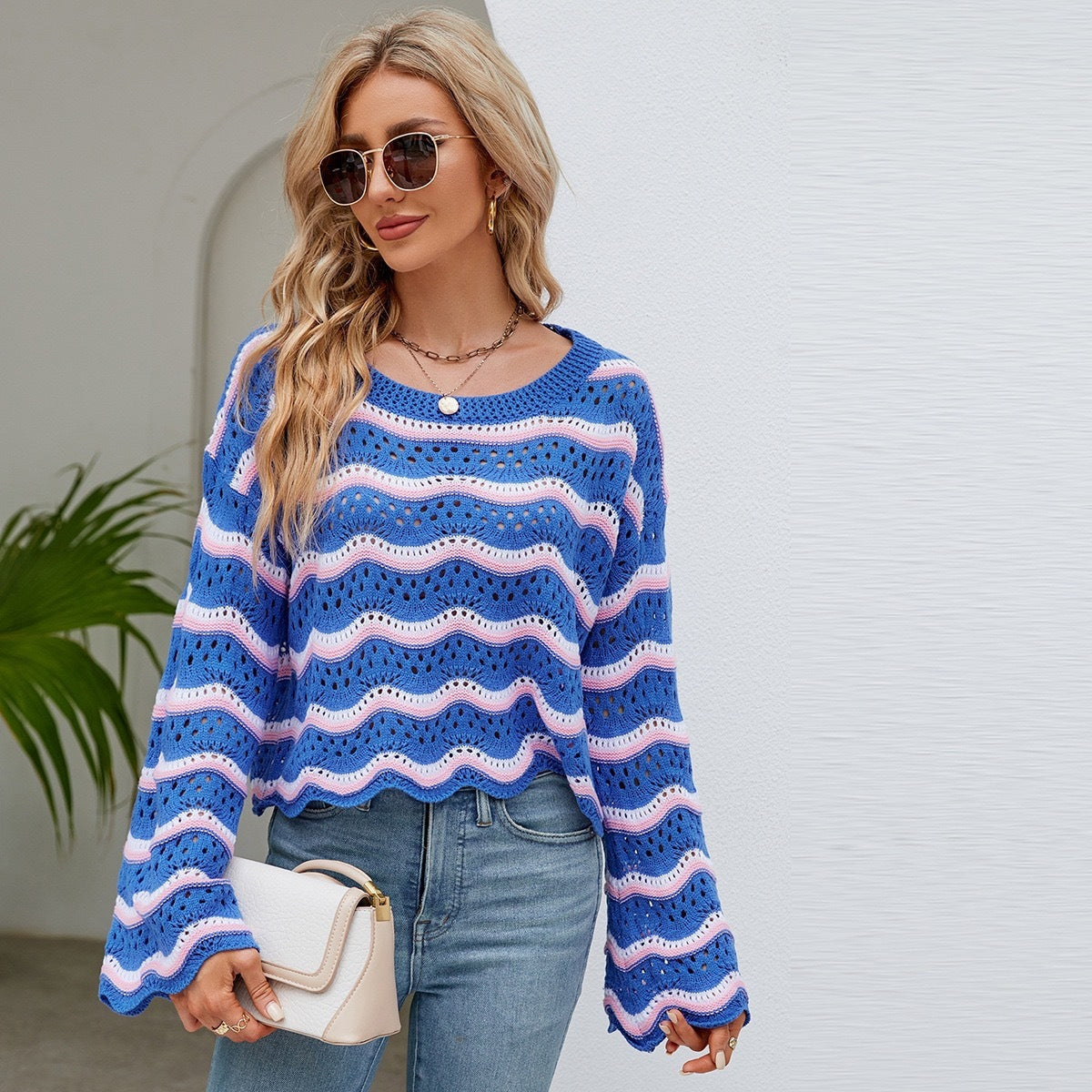 Women’s striped knit pullover sweater with long sleeves, crew neck; light blue with purple and white wavy stripes