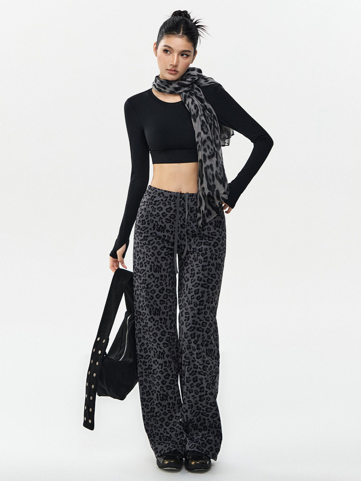 Women’s wide-leg leopard-print pants, gray with black spots; drawstring waist, loose fit.