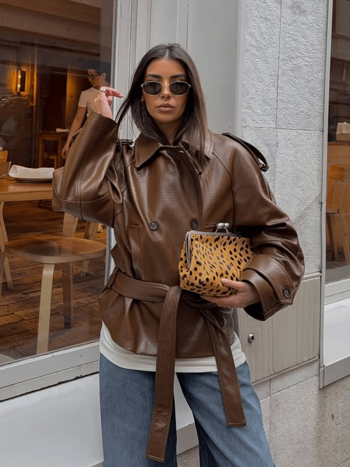 Brown pebbled leather short double-breasted belted motorcycle jacket with tie belt