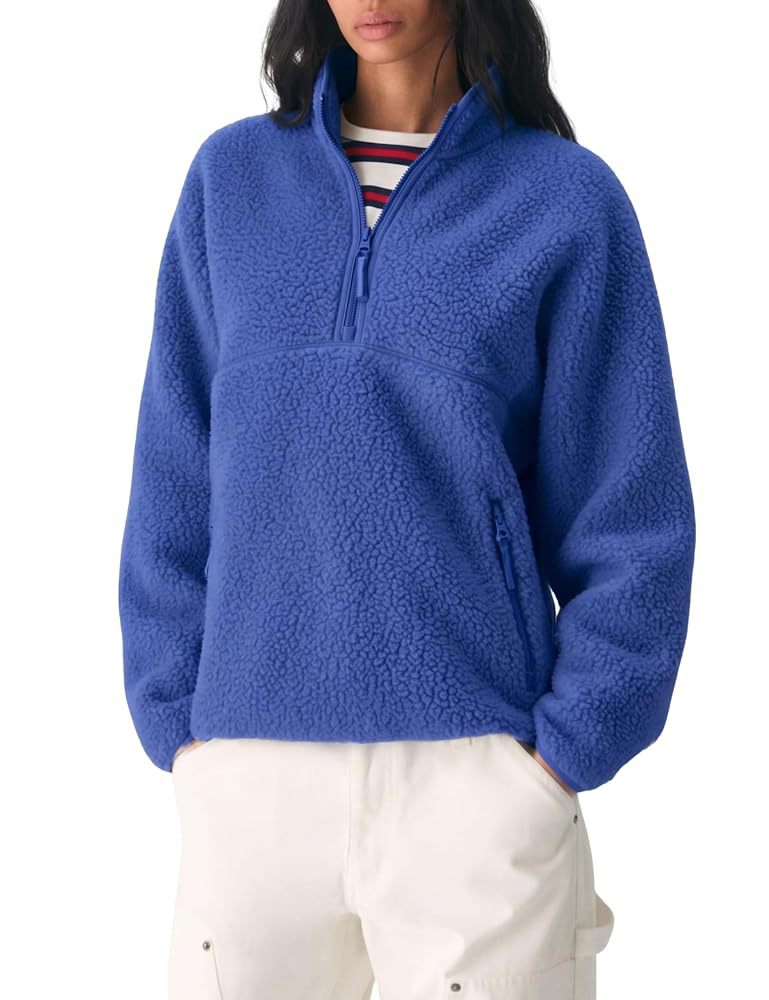 Women’s blue fleece quarter-zip pullover with front pocket and long sleeves