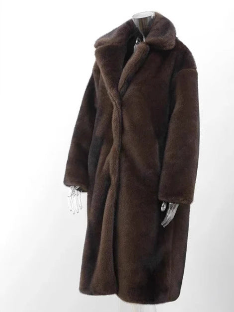 Women's brown faux fur longline coat with wide lapel and side pockets, oversized