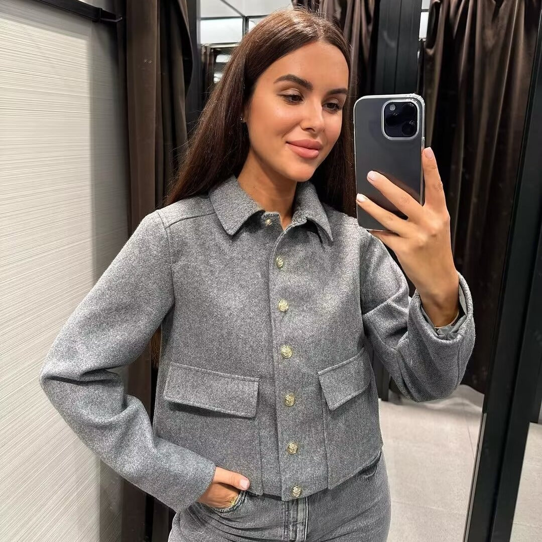 Women’s gray single-breasted jacket with notch lapel, button front, and flap pockets