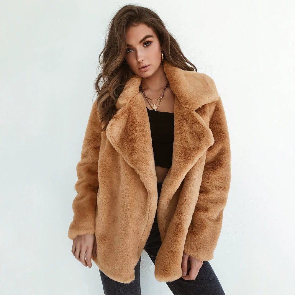 Tan faux fur jacket with shawl-style lapels, open front and long sleeves