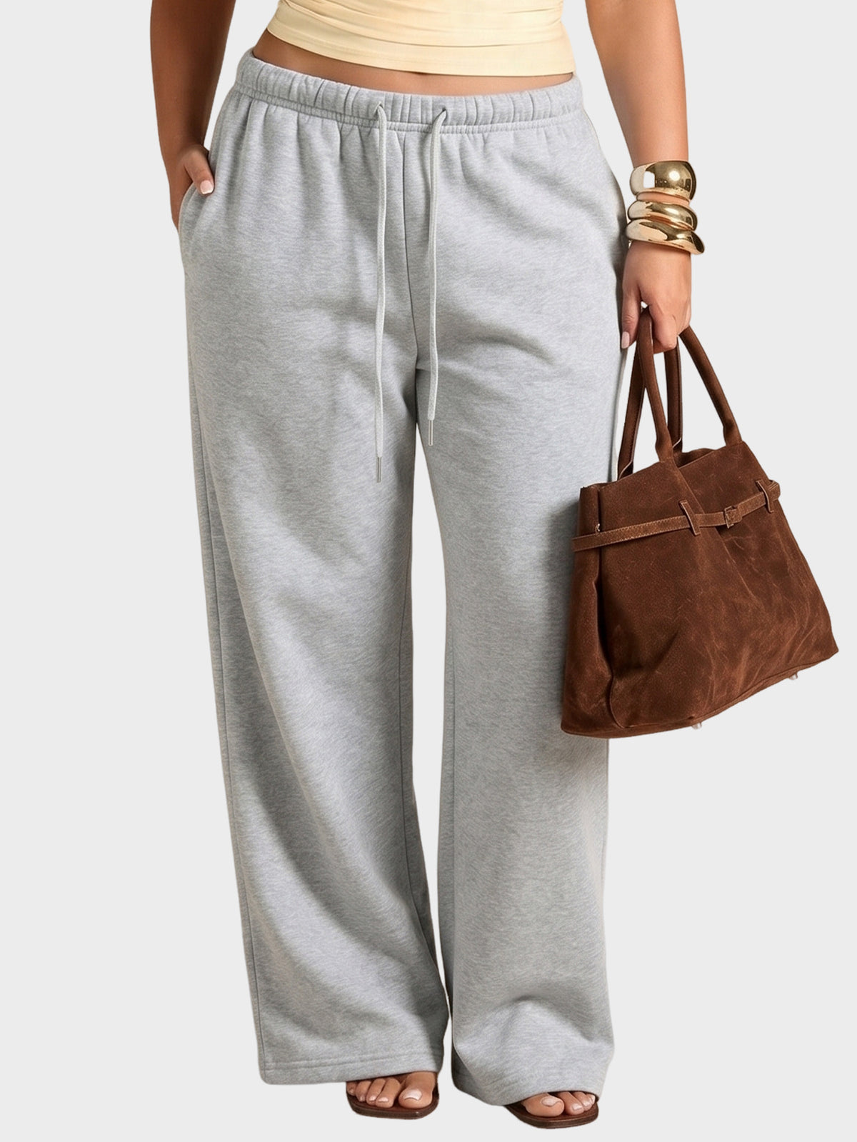 Grey high-waisted wide-leg sweatpants with drawstring elastic waist, full-length relaxed fit