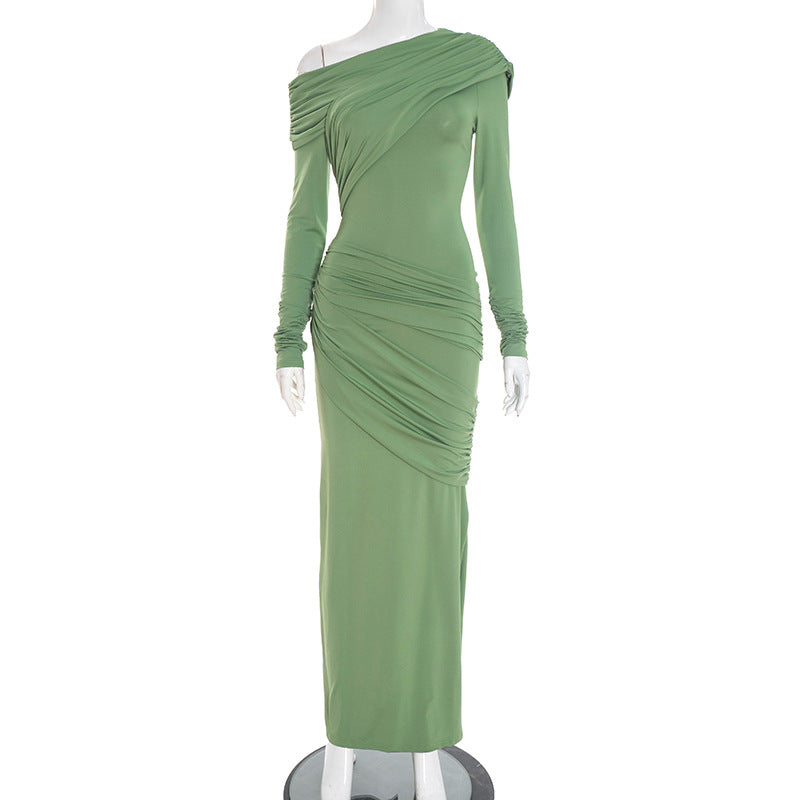 Green off-shoulder pleated long dress on mannequin with long sleeves