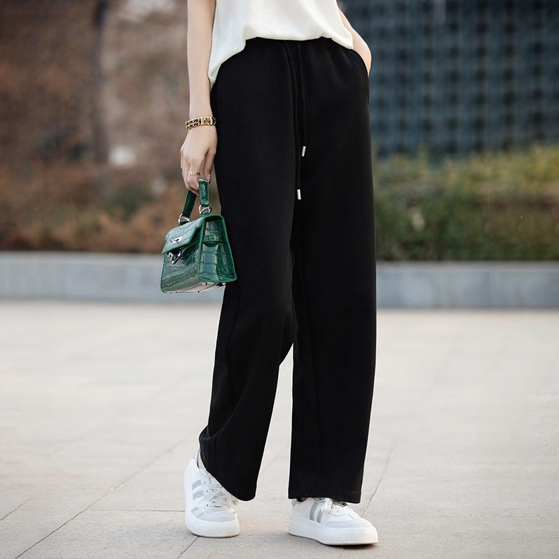 Women’s black wide-leg pants with elastic waistband and drawstring, relaxed straight silhouette