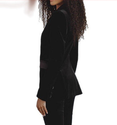 Women’s black velvet slim-fit blazer shown in side view with satin lapel trim