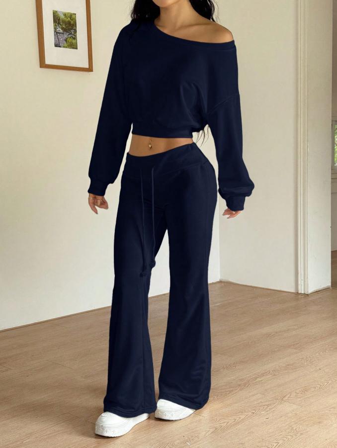 Dark navy off-shoulder cropped sweatshirt with long sleeves and drawstring bell-bottom pants