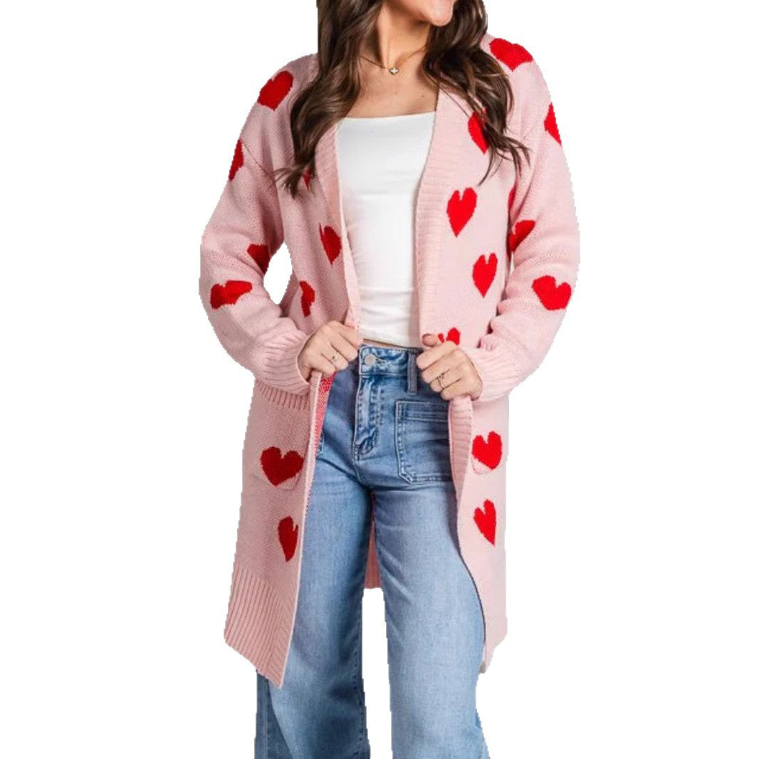 Pink knit cardigan featuring red hearts, open front, long sleeves, mid-length length