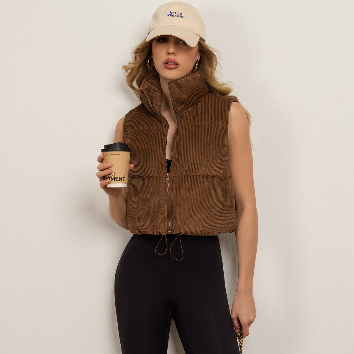 Women’s sleeveless brown quilted vest with stand collar and front zipper