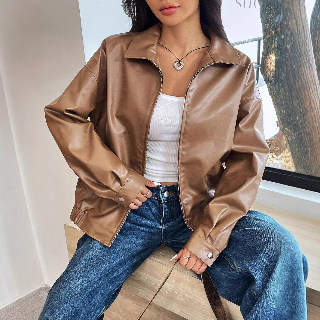 Brown faux-leather moto jacket with zip front, stand collar, and long sleeves