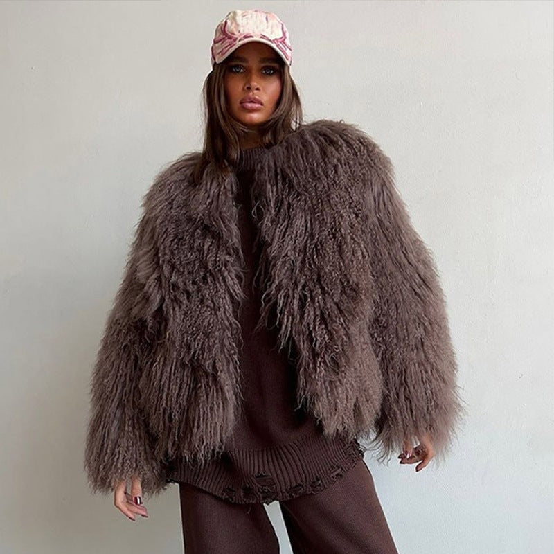 Brown short faux fur coat with long sleeves, shaggy texture, front view