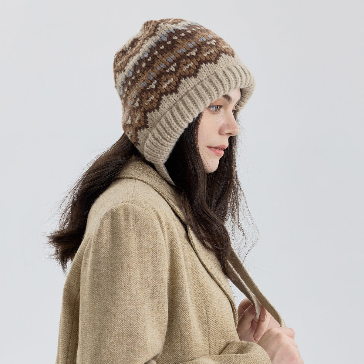 Fair Isle knit beanie with ribbed cuff and long tie strap, beige and brown stripe pattern