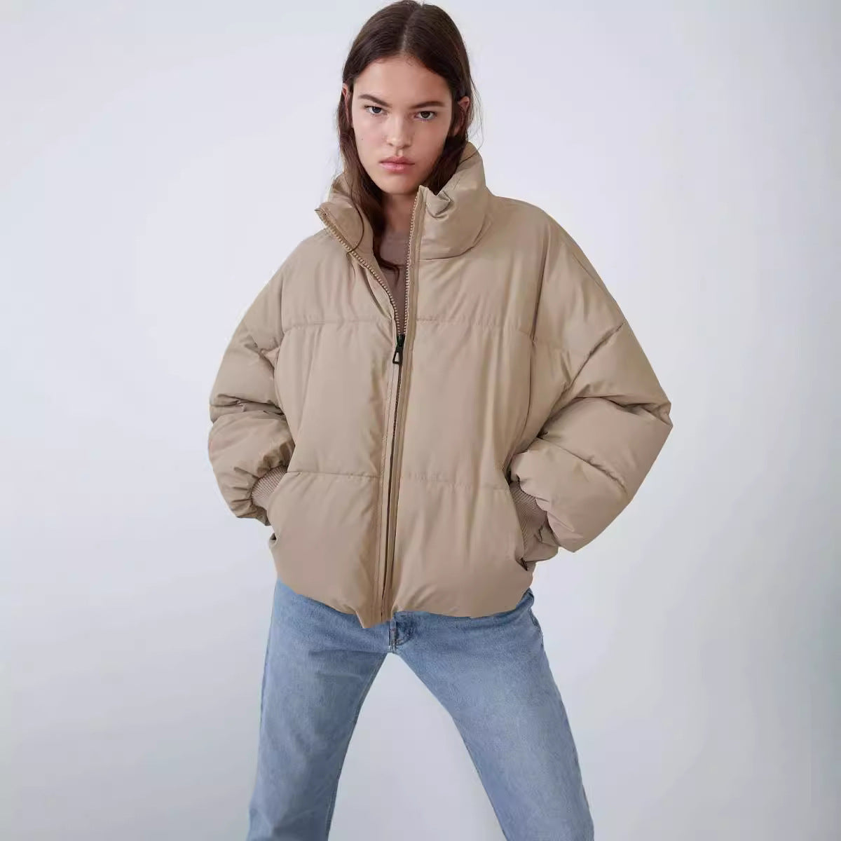 Women's khaki zip-front puffer jacket with stand collar and side pockets