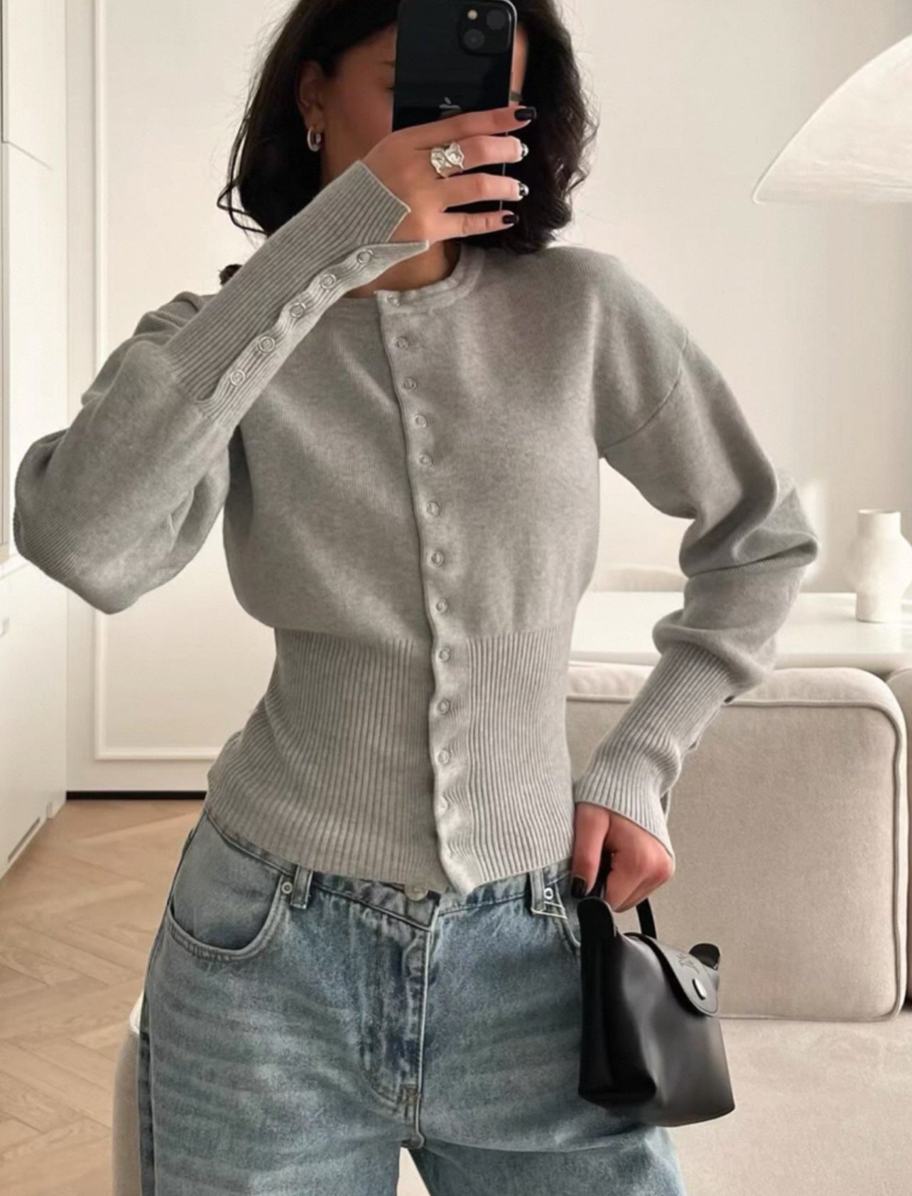 Women’s light grey knitted cardigan sweater with button-front placket and long sleeves