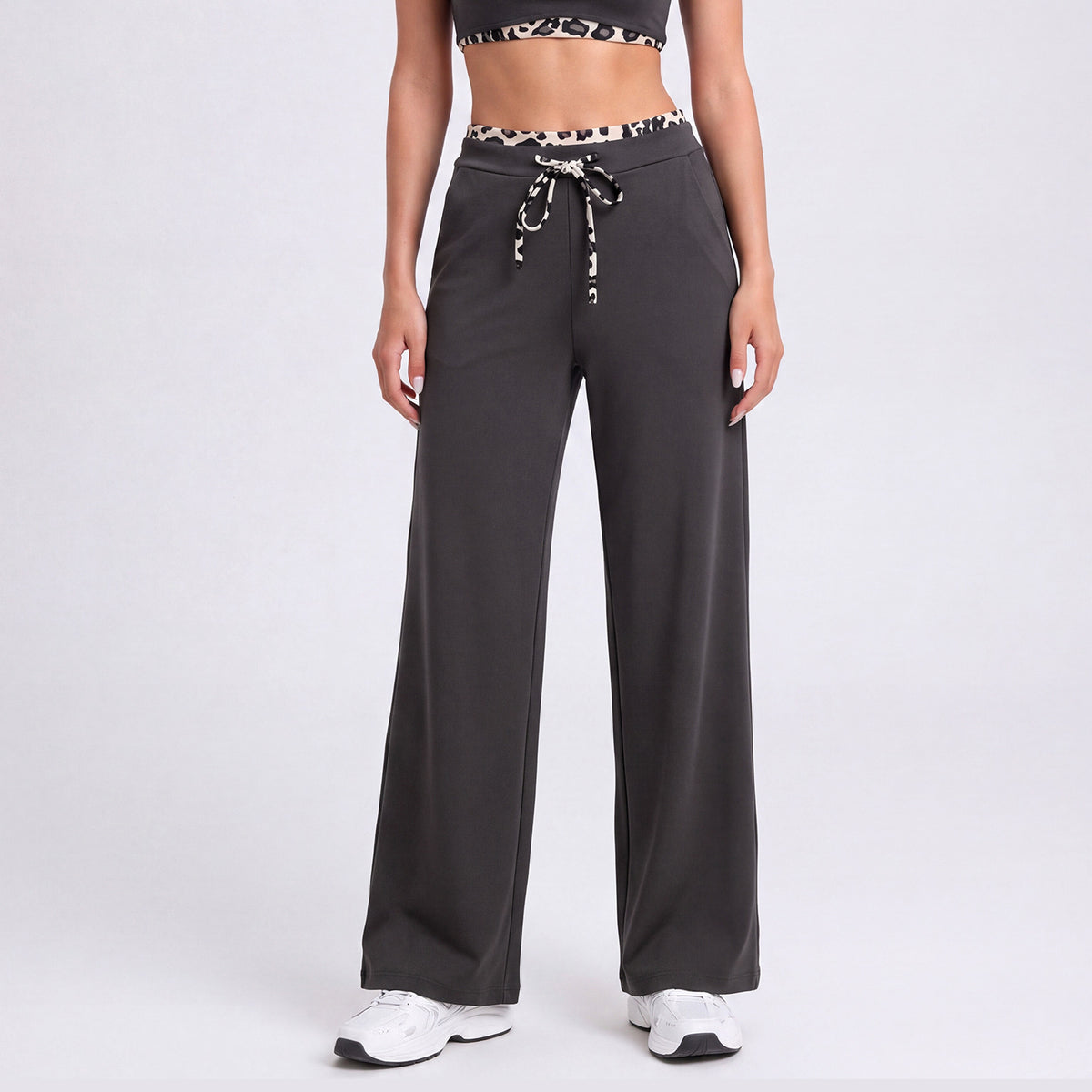 Women's straight-leg athletic pants, deep black with leopard-trim drawstring waistband
