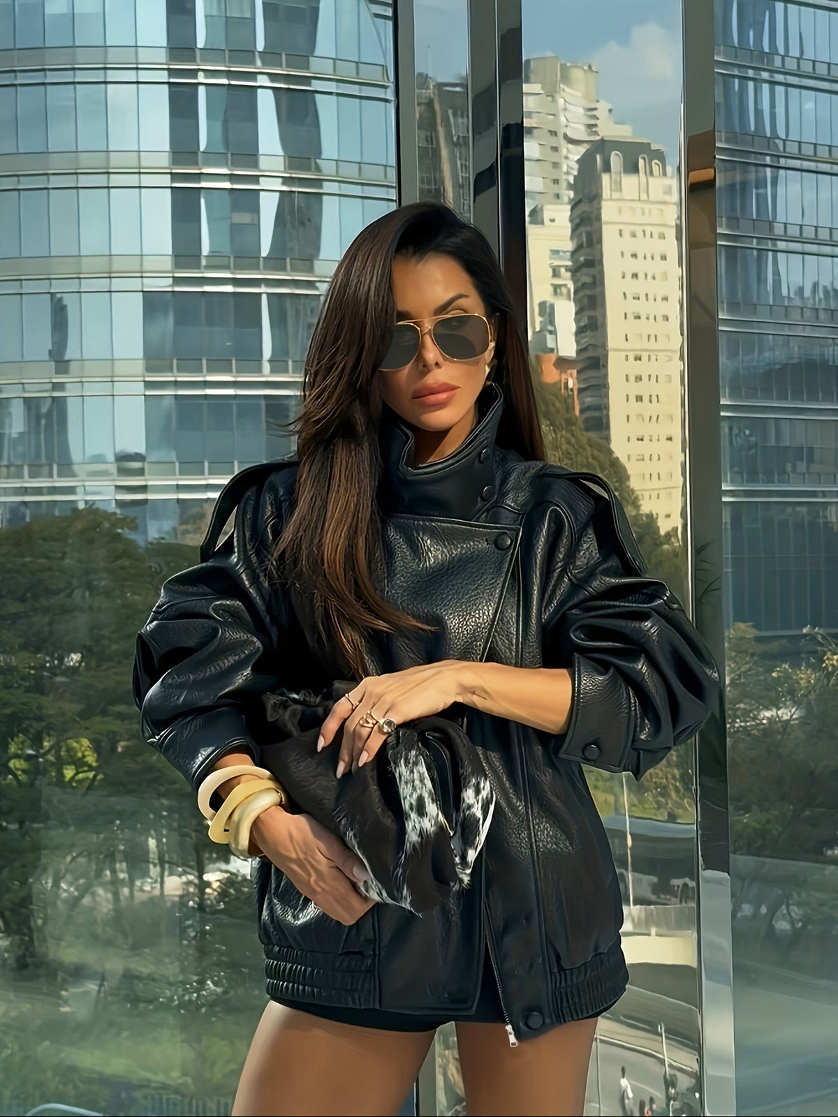 Black faux leather oversized moto jacket with asymmetric zip and ribbed hem