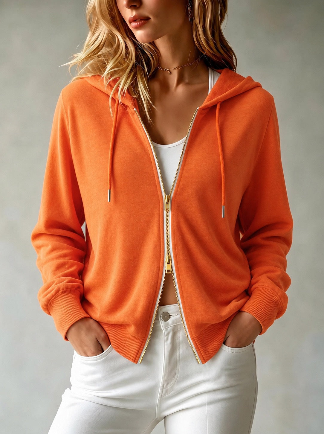 Women's orange knit hooded zip-up cardigan with drawstrings and ribbed hem