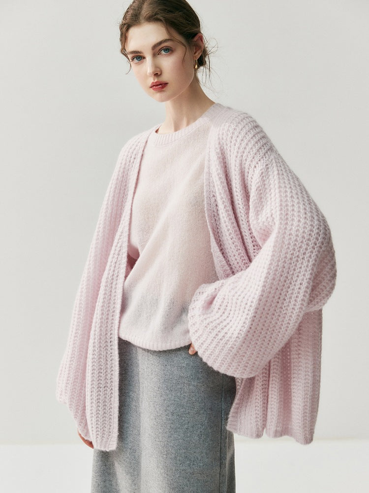Light pink loose knitted cardigan with long sleeves and open front
