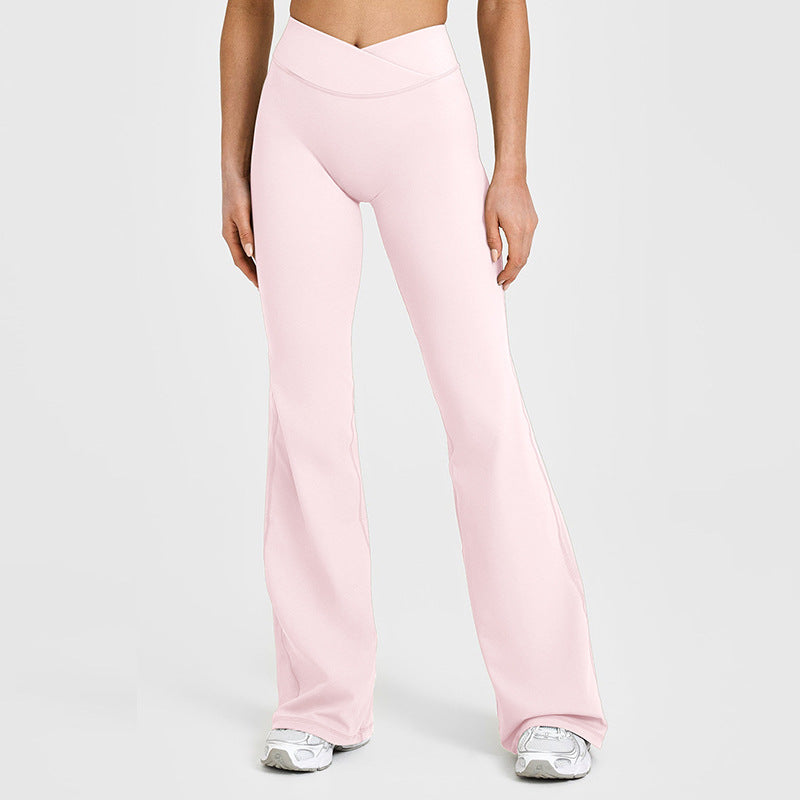 Women’s flared yoga pants in blush pink with high-rise waistband and wide-leg flare