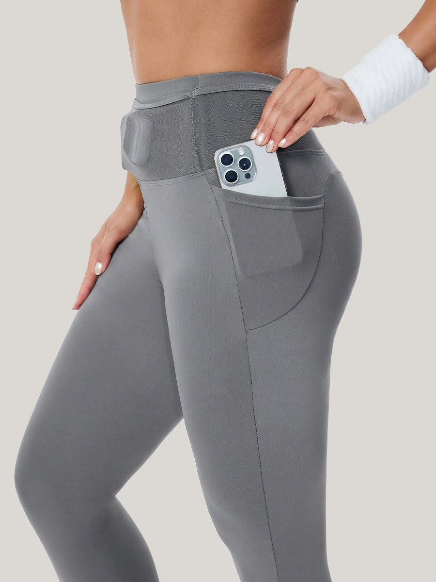 High-waisted gray leggings with phone pocket and hand-held side pocket
