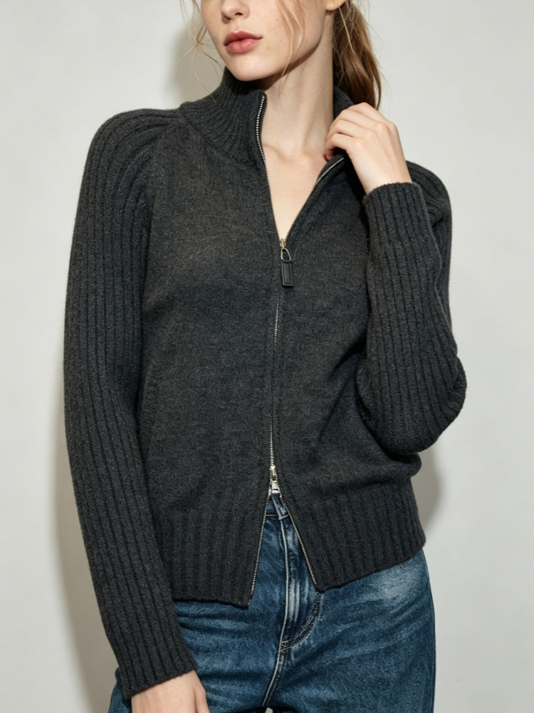 Women's dark gray ribbed knit zip-up sweater jacket with stand collar and front zipper.