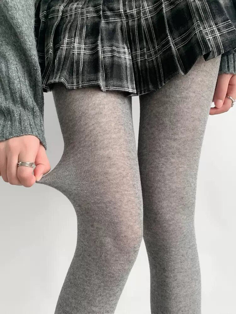Matte sheer light gray pantyhose with slim, semi-transparent leg coverage