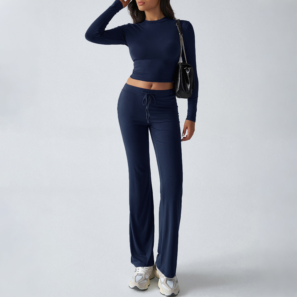 Navy two-piece sweatsuit set with cropped long-sleeve top and drawstring wide-leg pants