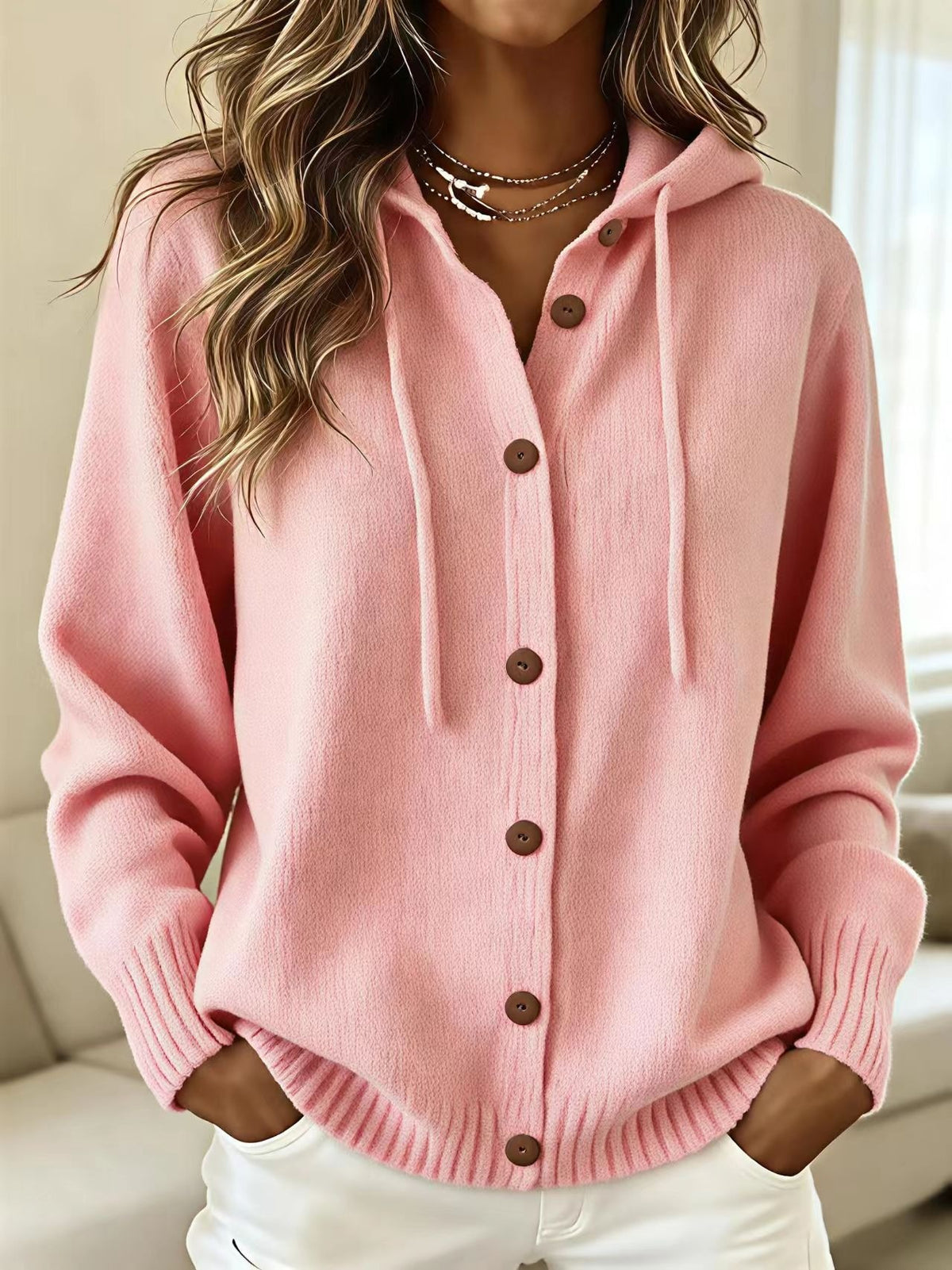 Pink hooded knit cardigan sweater with front button placket and drawstring hood